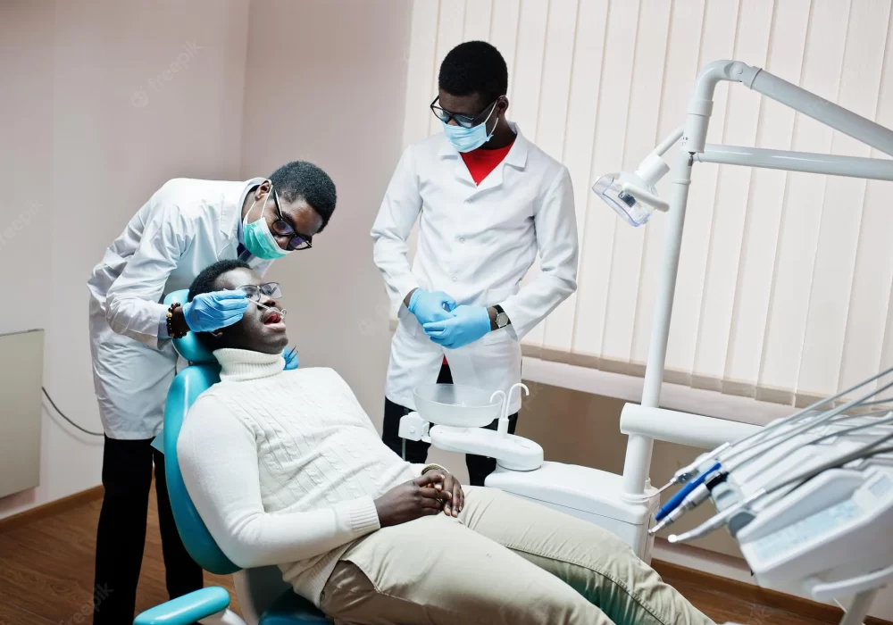 african-american-man-patient-dental-chair-dentist-office-doctor-practice-concept-professional-dentist-helping-his-patient-dentistry-medical_627829-13719